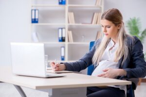Woman at Desk Pregnancy Discrimination