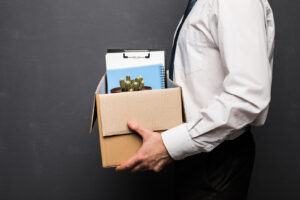 Employee carrying box of work after being terminated
